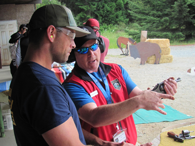 A range safety officer teaching safe gun handling during Outdoor Discovery Day 2016.